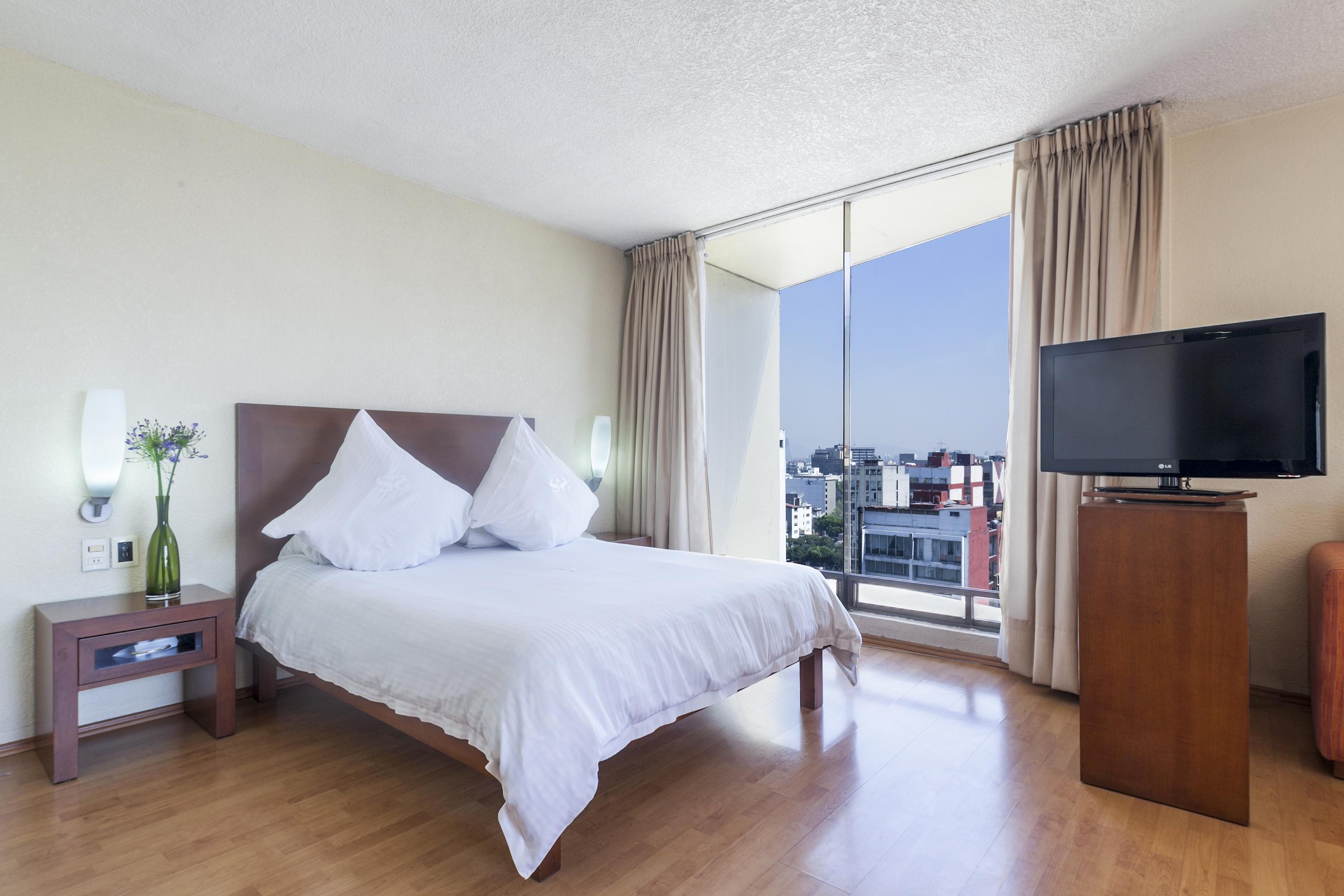 เอ็กเซ สวีท ซาน มารีโน Aparthotel เม็กซิโกซิตี้ ภายนอก รูปภาพ A bedroom at the hotel