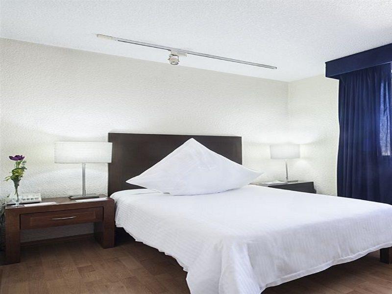เอ็กเซ สวีท ซาน มารีโน Aparthotel เม็กซิโกซิตี้ ภายนอก รูปภาพ A bedroom at the hotel